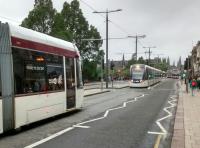 I know trams don't have a block system, but this is the smallest headway<br>
I've seen: a length. Two York Place trams photographed in Princes Street on<br>
04/07/2017.<br><br>[David Panton 04/07/2017]