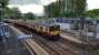A westbound train at Dalreoch viewed from the station footbridge. The view shows just how close to the end of the platform the station building is, the junction between the Helensburgh and Balloch lines being just behind the camera.<br><br>[Beth Crawford 18/05/2017]
