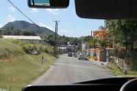 A former level crossing in Sandy Point Town, St Kitts, immediately to the south of the La Vallee limit of rail operations. This view was taken from a bus returning rail passengers to Basseterre to complete the circular trip. The twelve mile disused section of line can be seen at various points from this road along the west coast.<br><br>[Mark Bartlett 18/02/2017]