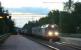 Dusk is finally approaching as the 22.32 Upptåget leaves Vattholma Station <I> en route </I> for Gävle. It crosses a Down (southbound) container train hauled by a 1996 vintage Hectorrail Class 141 loco with all headlights blazing. For more information on this see <br>
http://www.hectorrail.com/products/class-141-queen-of-traction/<br>
<br><br>[Charlie Niven 13/06/2012]
