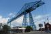 Middlesbrough's famous transporter bridge on 24th June 2017, when it was unfortunately out of service awaiting repairs. By one of those strange coincidences my first visit to this location was eight years to the day that I had visited its sister bridge at Rochefort in France [See image 24425]. The sturdy cables dropping vertically from the ends of the bridge are anchored deep underground to hold the cantilevered deck in tension.<br><br>[Mark Bartlett 24/06/2017]