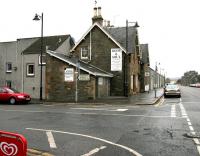 The former Kirkcudbright station, looking north along the A711 Saint Mary Street in November 2005, some 40 years after closure. Housing now covers the site of the former platforms but the main station buildings still survive.<br><br>[John Furnevel 22/11/2005]