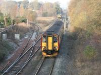 A Glasgow - Carlisle train passing the former junction with the Stranraer line north of Dumfries station in November 2005. The short branch serving the former ICI factory at Cargenbridge had closed in 1994.<br><br>[John Furnevel 10/11/2005]