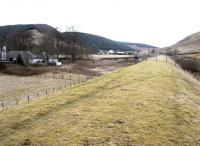 Looking south along the trackbed of the Talla Railway between Broughton and Victoria Lodge in November 2004. The old Crook Inn stands to the left between the trackbed and the road.<br><br>[John Furnevel 13/11/2004]