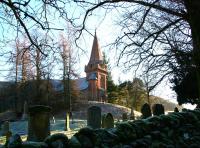 The old church at Tweedsmuir, about a mile from the former railhead at Victoria Lodge, in November 2005. The faded headstone in memory of those who were killed during the Talla project stands near the main gate. [See image 6409]<br><br>[John Furnevel 30/11/2005]