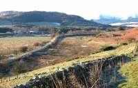 At first glance the tyre tracks along the frosty embankment give the impression of rails still in place. View is west towards Broughton along the trackbed of the Symington, Biggar and Broughton Railway in November 2005. The Talla Railway branched south behind Rachan Farm on the left of the picture. <br><br>[John Furnevel 30/11/2005]