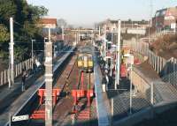 First day of service at the new Larkhall station on 12 December 2005 with 318255 arriving at platform 2.<br><br>[John Furnevel 12/12/2005]