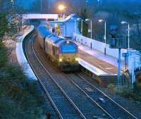 One of the recently introduced First ScotRail locomotive hauled services, headed by EWS 67030, calls at Inverkeithing with an early morning inbound Fife Circle train on a cold and frosty 19 December.<br><br>[Bill Roberton 19/12/2008]