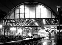 Evening scene at Kings Cross in February 1979, looking back towards the station along platform 8 with empty stock about to leave platform 7.<br><br>[John Furnevel 12/02/1979]