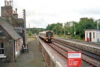 A train for Inverness southbound from Lairg in September 2001, seen from the footbridge steps.<br><br>[John Furnevel 09/09/2001]