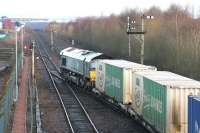 Looking towards Grangemouth Docks from Fouldubs Junction in January 2006 as DRS 66406 eases a container train forward from the W H Malcolm depot.<br><br>[John Furnevel 24/01/2006]