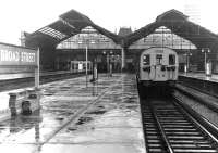 Scene at Broad Street on a wet day in 1984 - with another 2 years to go before official closure on 30 June 1986. A North London Line service from Richmond stands at the platform.<br><br>[John Furnevel 11/08/1984]