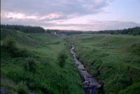 Wilsontown Ironworks: looking north over <i>the cundie</i> (drain), the removed culvert over the Mouse Burn, on which part of the works and the Wilsontown Waggonway stood. Photograph taken from the Wilsontown Branch.<br><br>[Ewan Crawford //]