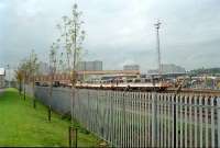 Behind the fence is the locomotive works of the Caledonian Railway, still in use.<br><br>[Ewan Crawford //]