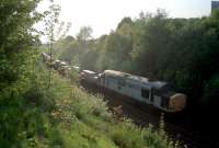 Class 37 hauling aluminium trains east towards Maryhill seen by Dawsholm Park.<br><br>[Ewan Crawford //]