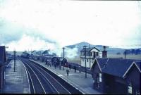 The Scottish Rambler about to leave for Beattock. 42737 has run round the train on return from Broughton. [see image 21198]<br><br>[John Robin 29/03/1964]