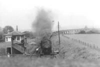 90553 comes off Alloa swing bridge and into Throsk with coal empties in June 1963<br><br>[John Robin 07/06/1963]