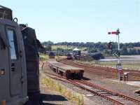 Army vehicles and EWS train at Montrose. First ScotRail service coming off viaduct.<br><br>[Mick Golightly //]