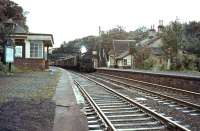 Platform view south at Abington on 26 September 1964 as Black 5 44672 runs through the station with a down freight.<br><br>[John Robin 26/09/1964]