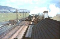 BR Standard class 4 2-6-0 76098 about to run south through Lamington on 25 March 1966 with an up ballast train.<br><br>[John Robin 25/03/1966]