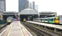 Looking west towards the trainshed over platforms 9 - 16 at London Bridge station on a Saturday morning in July 2005. The structure is likely to be demolished as part of a planned station rebuild, details of which are being finalised. On the left is one of the Class 456 units operating the South London Line shuttle service between London Bridge and Victoria.<br><br>[John Furnevel 23/07/2005]