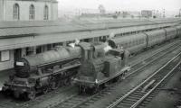 45559 from Blackpool passes station pilot 55189 (now preserved by SRPS).<br><br>[John Robin 04/08/1962]