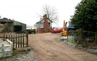 Entrance to Moniaive station, terminus of the Cairn Valley Railway, in January 2006. The station building stands alongside the modified goods shed 57 years after the line was closed completely by BR.<br><br>[John Furnevel 31/01/2006]