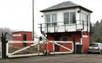 Holywood signal box and crossing, Dumfriesshire, looking east in January 2006. The crossing gates at this location continue to be operated manually using a wheel within the box.<br><br>[John Furnevel 31/01/2006]