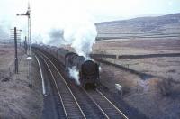 Britannia Pacific 70023 <I>Venus</I> is deputising for a failed diesel locomotive on 2 January 1967 as it tops Beattock Summit in a flurry of light snow.<br><br>[John Robin 02/01/1967]