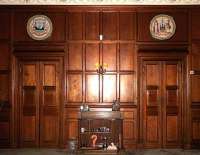 Rear wall of boardroom at Victoria Lodge with the seals of the corporations of Leith (left) and Edinburgh above the doors. February 2006.<br><br>[John Furnevel 01/02/2006]