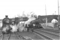 Preserved NB 256 with the SLS/BLS <I>Scottish Rambler No 3</I> from Bonnybridge waits at Greenhill Lower station on 30 March 1964 for V2 60835 to pass with the 3.10pm Aberdeen to Glasgow 'Postal'.<br><br>[John Robin 30/03/1964]