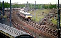 A BR Edinburgh - London InterCity service west of Craigentinny depot in May 1993. To the right the South Leith branch meets the ECML at Portobello West Junction.<br><br>[John Furnevel 14/05/1993]