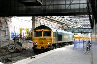 A ballast train arrives at Waverley platform 1 on Sunday morning 26 February 2006.<br><br>[John Furnevel 26/02/2006]