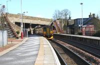 A Glasgow Central - Edinburgh Waverley train leaves Shotts on 13 February 2006 passing north east under Station Road.<br><br>[John Furnevel 13/02/2006]