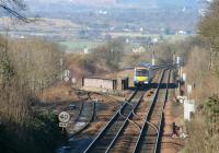 A westbound train passes Newbridge Junction in March 2006, with the Bathgate branch diverging to the left from the main Edinburgh - Glasgow line.<br><br>[John Furnevel 12/03/2006]