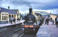 Preserved ex-Highland Railway Jones Goods no 103 is developing a noticeable hot spot on its smokebox door as it waits at Carrbridge station with a special on 21 August 1965.<br><br>[John Robin 21/08/1965]