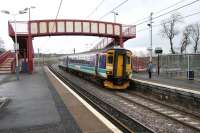 A train for Waverley arriving to pick up the passenger at Curriehill station on 7 March 2006.<br><br>[John Furnevel 07/03/2006]