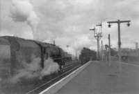 76073 passes 46249 on Carlisle train at Mauchline as night falls.<br><br>[John Robin 30/09/1963]