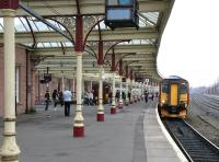 A Glasgow - Carlisle service arrives at Kilmarnock platform 3 on 27 March 2006. Recently arrived in bay platform 2 is the 11.48 from Stranraer Harbour, which will depart as the 1350 to Glasgow Central.<br><br>[John Furnevel 27/03/2006]