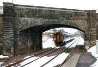 Platform view south from Sanquhar on 14 March 2006 following a heavy snowfall the previous day. ScotRail 156478 has just passed below the bridge carrying St Mary's Street after restarting a Glasgow - Carlisle service.<br><br>[John Furnevel 14/03/2006]