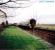 A speeding along passenger train passes Watten on the way to Georgemas from Wick.<br><br>[Ewan Crawford //]
