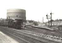 A Glasgow bound train ex-Gourock photographed at Ibrox on 27 July 1955 behind Fairburn 2-6-4T 42240. On the right are the disused Govan branch platforms. Govan had closed to passenger traffic in 1921.<br><br>[G H Robin collection by courtesy of the Mitchell Library, Glasgow 27/07/1955]