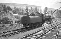 Shunting Langholm goods yard in 1965. The locomotive is Ivatt 2-6-0 no 43049.<br><br>[Bruce McCartney //1965]