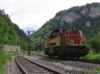 Traditional semaphore signals survive on the Tuttlingen-Sigmaringen single-track section of the Ulm-Donaueschingen cross-country link, seen here at Hausen im Tal on 7th June 2017. The light diesel - actually a freight service without any traffic that day - is a centre-cab Class V180 of the regional Hohenzollerische Landesbahn company.<br><br>[David Spaven 07/06/2017]