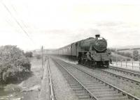 A Glasgow - Manchester train crosses Martinton Bridge over the River Nith in the summer of 1961 on the northern approach to Dumfries station. Polmadie Black 5 no 45172 is in charge. <br><br>[G H Robin collection by courtesy of the Mitchell Library, Glasgow 15/07/1961]
