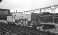 Waiting patiently on the centre road at the south end of Carlisle on 24 August 1963 is A1 Pacific no 60118 <I>Archibald Sturrock</I>. The locomotive is rostered to take over the summer Saturday 1.57pm Gourock - Birmingham New Street via Leeds City.<br><br>[K A Gray 24/08/1963]