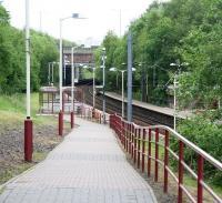 The ramped entrance from Nithsdale Road leading down to platform 1 at the deceptively rural looking Dumbreck station. The next stop, less than two miles away and with a journey time of just over four minutes, is Glasgow Central. View is north east on a quiet Sunday morning in May 2007.<br><br>[John Furnevel 20/05/2007]