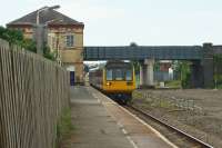 A Blackpool to Huddersfield service arrives at Kirkham and Wesham on 05 July 2017. On the right the former fast lines have been removed and the formation levelled. A new third platform is due to be built on this area in connection with the electrification of the line from Preston to Blackpool North.<br><br>[John McIntyre 05/07/2017]