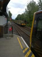 There's something rather Continental about some sections of the Tyne and Wear Metro. Trams for South Hylton (left) and Airport (right) are shown crossing in this evening view at Kingston Park in July 2015.<br><br>[Ken Strachan 11/07/2015]