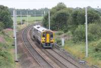 Catenary masts are now being erected in various places along the Preston to Blackpool North line although it will be a little while before the wiring is installed. Northern 158793, running from Blackpool to York, approaches Darkinson Lane bridge between Salwick and Lea Road on 20th July 2017. <br><br>[Mark Bartlett 20/07/2017]